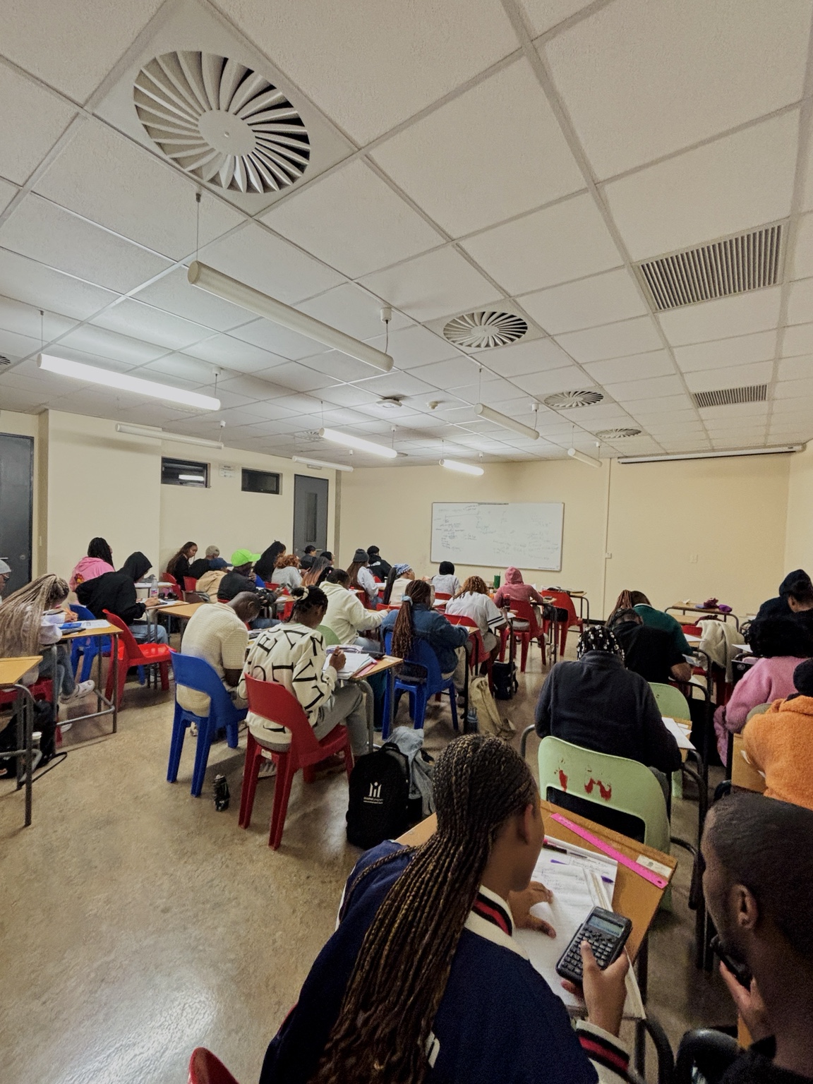 Students working through accounting material during a group session