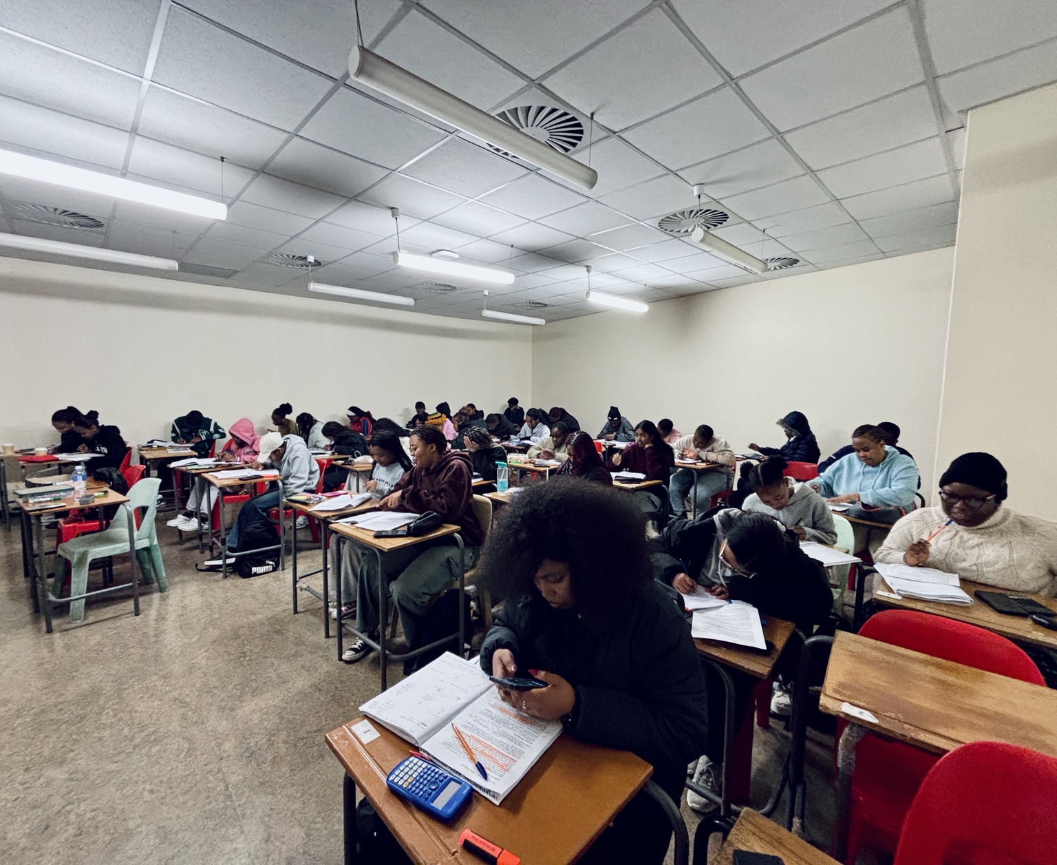 Large group tutoring session with students studying accounting